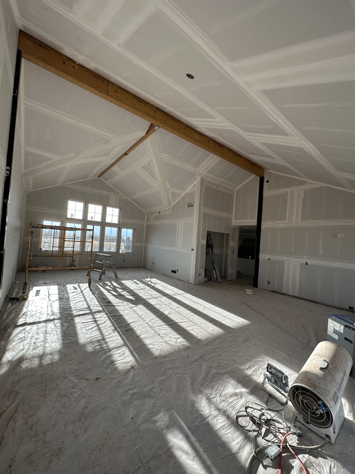 Large residential drywall project with vaulted ceiling